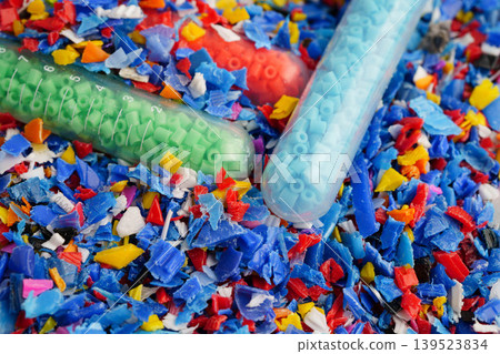Plastic colorful pieces recycling shredded for industrial use. Plastic colorful pieces recycling shredded for industrial use. 139523834
