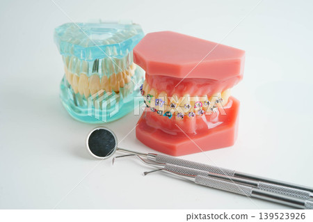 Teeth dental model with tool for dentist use to cleaning care treatment. Teeth dental model with tool for dentist use to cleaning care treatment. 139523926
