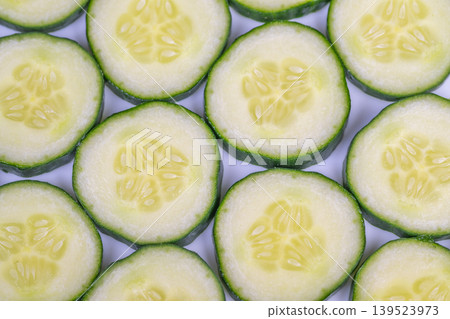 Detailed view of cucumber seeds. Close examination of cucumber seed patterns. Macro photograph highlighting cucumber seed clusters and pulp textures for editorial purposes Detailed view of cucumber seeds. Close examination of cucumber seed patterns. Macro photograph highlighting cucumber seed clusters and pulp textures for editorial purposes 139523973