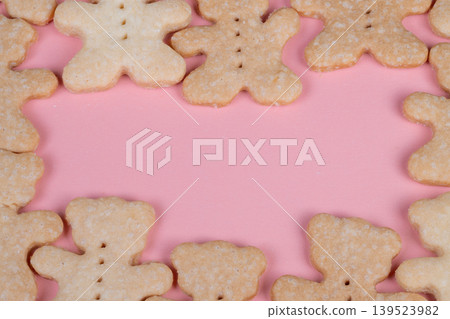 Decorative cookies on pastel background. Playful sugardusted cookies arranged for display. Stylish flat arrangement of cookies with ample area for captions or invitations Decorative cookies on pastel background. Playful sugardusted cookies arranged for display. Stylish flat arrangement of cookies with ample area for captions or invitations 139523982