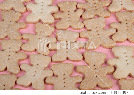Artisan bear cookies. Homemade golden bear confections. Closeup of warm bakery bear treats. Decorative handcrafted bear cookies with sugar crystals and button eyes Artisan bear cookies. Homemade golden bear confections. Closeup of warm bakery bear treats. Decorative handcrafted bear cookies with sugar crystals and button eyes 139523983