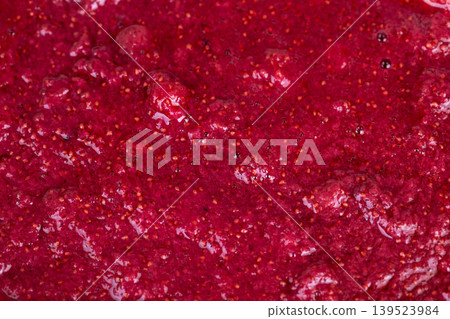 Detailed examination of fresh strawberries showing seed and pulp textures. An upclose perspective highlighting vibrant red color and textured details of freshly picked strawberries Detailed examination of fresh strawberries showing seed and pulp textures. An upclose perspective highlighting vibrant red color and textured details of freshly picked strawberries 139523984