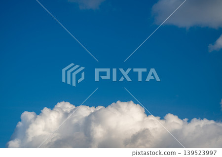 Tranquil open air sky. Calm and breezy expansive sky with light fluffy clouds drifting. Serene and airy sky filled with gentle clouds drifting softly in peaceful atmosphere Tranquil open air sky. Calm and breezy expansive sky with light fluffy clouds drifting. Serene and airy sky filled with gentle clouds drifting softly in peaceful atmosphere 139523997