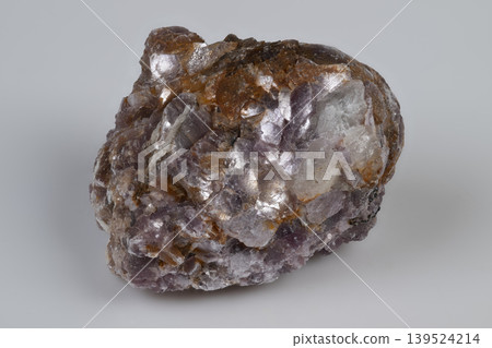 Detailed mineral photograph. Close view of crystalline lepidolite with shiny appearance. Photograph of lepidolite crystal cluster highlighting metallic shine and structure Detailed mineral photograph. Close view of crystalline lepidolite with shiny appearance. Photograph of lepidolite crystal cluster highlighting metallic shine and structure 139524214