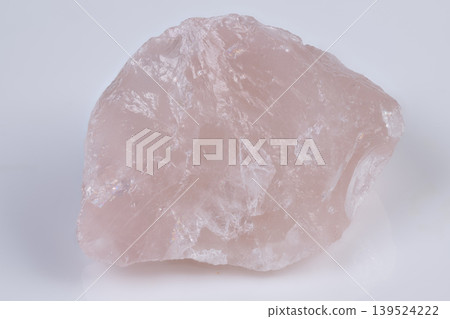 Pink mineral closeup. Crystalline rose quartz with subtle translucence captured. Highresolution photo showcasing intricate details of pink rose quartz mineral specimen Pink mineral closeup. Crystalline rose quartz with subtle translucence captured. Highresolution photo showcasing intricate details of pink rose quartz mineral specimen 139524222