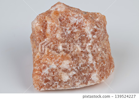 Meditation altar with sparkling translucent calcite. Decorative wellness display showcasing vibrant orange calcite with warm ambient illumination and sparkling highlights 139524227