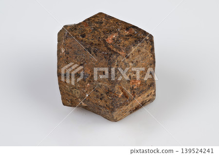 Studiolit macro image of rough garnet crystal with dodecahedral facets. Highresolution detailed photograph of isolated spessartine garnet mineral with textured surfaces Studiolit macro image of rough garnet crystal with dodecahedral facets. Highresolution detailed photograph of isolated spessartine garnet mineral with textured surfaces 139524241