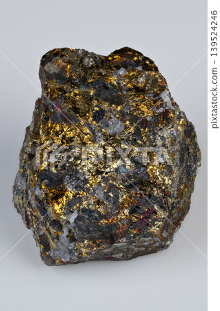 Dark matrix hosting shining gold fragments with textured appearance. Decorative and editorial suitable portrayal of mineral nugget with luminous gold accents and rugged surface Dark matrix hosting shining gold fragments with textured appearance. Decorative and editorial suitable portrayal of mineral nugget with luminous gold accents and rugged surface 139524246