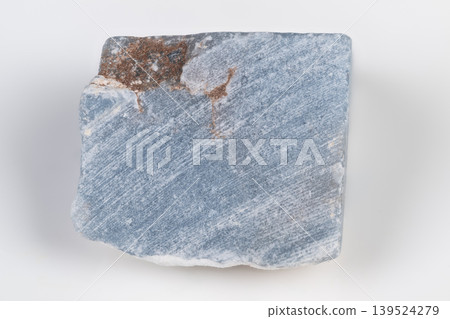 Blue mineral fragment. Light blue textured mineral piece. Soft pale blue stone with streaks and patterns. Rectangular pale blue mineral block displaying subtle streaks and textures Blue mineral fragment. Light blue textured mineral piece. Soft pale blue stone with streaks and patterns. Rectangular pale blue mineral block displaying subtle streaks and textures 139524279