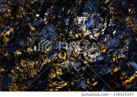 Closeup showcasing radiant crystalline and metallic details. High contrast detailed view highlighting reflective crystalline structures and metallic gleam with shadows 139524347