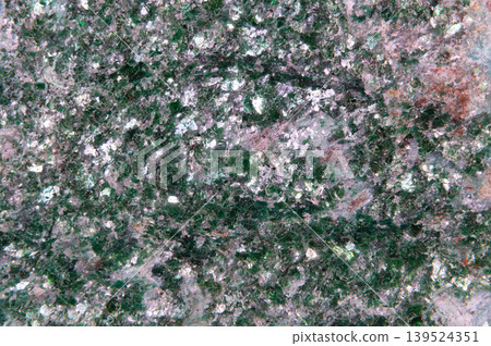 Texture of mineral exhibiting crystalline patterns and color. Highresolution image displaying mineral surface texture with vibrant colors and natural weathered features Texture of mineral exhibiting crystalline patterns and color. Highresolution image displaying mineral surface texture with vibrant colors and natural weathered features 139524351