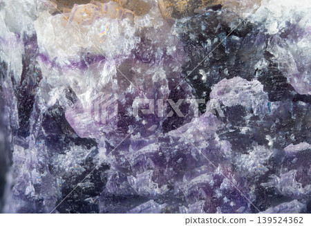 Purple crystal elegance. Translucent purple crystal surface with gentle white accents. Light violet mineral field featuring subtle white glows and textured matrix design 139524362