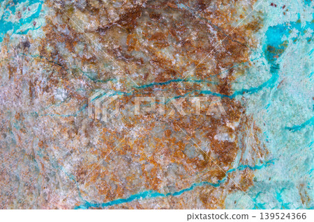 Urban industrial patina. Oxidized copper reveals textured bluegreen corrosion and flakes. Rough oxidized copper surface displays industrial decay aesthetic with corrosion 139524366