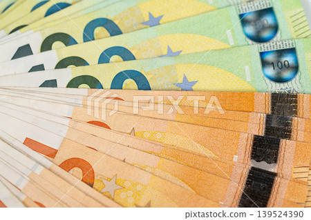 Array of euro banknotes signifies emergency preparedness and trustworthiness. Multiple layers of euro currency imply economic stability and readiness for unforeseen events Array of euro banknotes signifies emergency preparedness and trustworthiness. Multiple layers of euro currency imply economic stability and readiness for unforeseen events 139524390