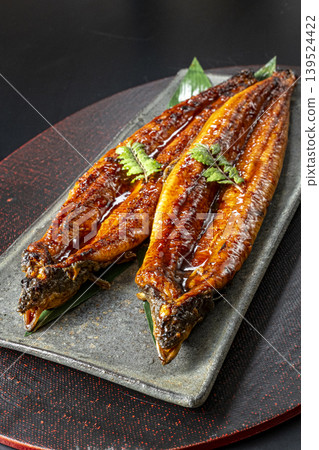 Delicious-looking grilled eel cooked over charcoal. Delicious-looking grilled eel cooked over charcoal. 139524422