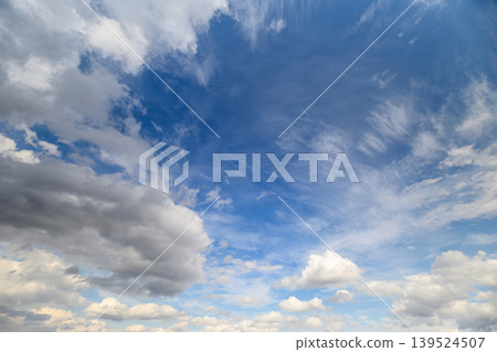 Bright sky with drifting clouds. Vast azure sky adorned with floating fluffy white clouds. Expansive cerulean sky filled with billowing cumulus clouds and tranquil atmosphere Bright sky with drifting clouds. Vast azure sky adorned with floating fluffy white clouds. Expansive cerulean sky filled with billowing cumulus clouds and tranquil atmosphere 139524507