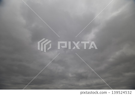 Gentle cloudy ambiance. Calm atmosphere featuring muted sky tones and gentle glow. Tranquil sky awash with gentle diffuse illumination and layered midtier cloud formations Gentle cloudy ambiance. Calm atmosphere featuring muted sky tones and gentle glow. Tranquil sky awash with gentle diffuse illumination and layered midtier cloud formations 139524532