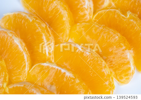 Fresh orange segments texture in closeup macro, organic repeating pattern and vibrant hue, artistic focus on membranes and juice droplets for design and editorial use Fresh orange segments texture in closeup macro, organic repeating pattern and vibrant hue, artistic focus on membranes and juice droplets for design and editorial use 139524593
