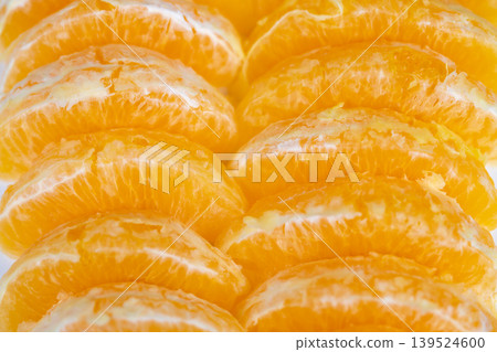 Photographic depiction emphasizing vivid textures and natural glossiness of oranges. Highresolution image capturing intricate details and vibrant colors of orange slices Photographic depiction emphasizing vivid textures and natural glossiness of oranges. Highresolution image capturing intricate details and vibrant colors of orange slices 139524600