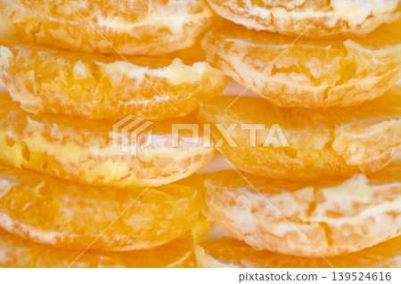 Fresh juicy mandarin pieces for smoothie prep, ingredientfocused closeup with vibrant color and pulpy texture, suggests blender use and energetic breakfast beverage Fresh juicy mandarin pieces for smoothie prep, ingredientfocused closeup with vibrant color and pulpy texture, suggests blender use and energetic breakfast beverage 139524616