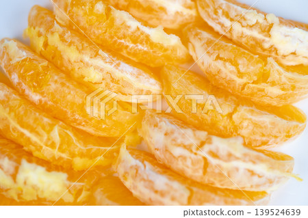 Fresh juicy orange slices staged for immune boost concept, vitaminrich segments, studio light highlighting glossy pulp and crisp edges, nutritionist styling vibe Fresh juicy orange slices staged for immune boost concept, vitaminrich segments, studio light highlighting glossy pulp and crisp edges, nutritionist styling vibe 139524639