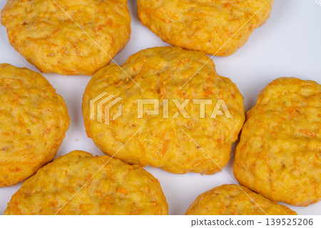 Homemade carrot cookies rustic golden rounds, soft textured cookies on white plate, cozy kitchen mood, smallbatch baking, warm lighting, comfort snack, food blogger styling Homemade carrot cookies rustic golden rounds, soft textured cookies on white plate, cozy kitchen mood, smallbatch baking, warm lighting, comfort snack, food blogger styling 139525206