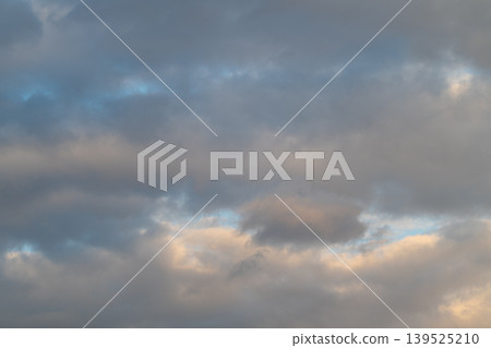 Sky filled with glowing clouds creating striking visual effects. Spectacular display of luminous clouds and contrasting light suitable for cinematic scenery and weather features 139525210