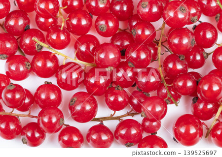 Studio shot capturing intense color and texture of red currants. Detailed still life showcasing glossy red currant stems with blurred background to suggest culinary uses 139525697