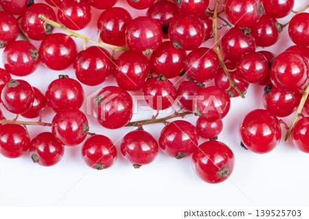 Shiny red berry arrangement spotlight. Elegant food photography capturing vibrant red currants with reflective surfaces and fine texture details for editorial purposes Shiny red berry arrangement spotlight. Elegant food photography capturing vibrant red currants with reflective surfaces and fine texture details for editorial purposes 139525703