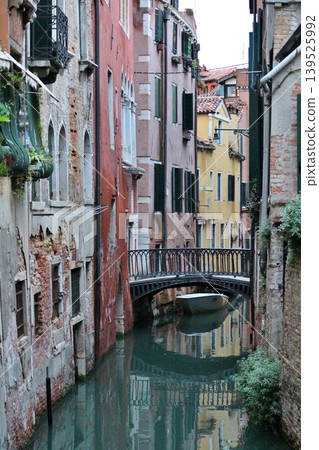 Sunset over the canals in the Castello district of Venice's old town, Italy. 139525992