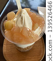 Peach soft serve ice cream with cereal 139526466