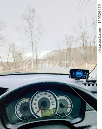 "The road conditions ahead and the view from the instrument panel, as seen from the driver's perspective." "The road conditions ahead and the view from the instrument panel, as seen from the driver's perspective." 139526489
