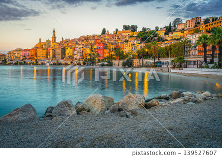 Colorful mediterranean seaside buildings and gravelly beach in Menton, France 139527607