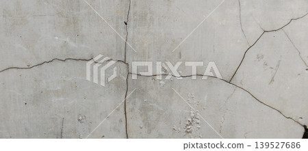 Abstract cracked concrete wall texture with a vintage feel. 139527686