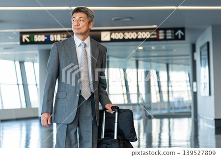 Businessman walking with a carry bag Businessman walking with a carry bag 139527809