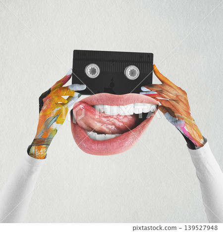 Creative hands holding retro cassette with funny mouth 139527948