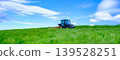 Summer blue sky, tractor, and vast landscape 139528251