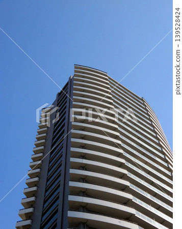High-rise apartments against a blue sky High-rise apartments against a blue sky 139528424