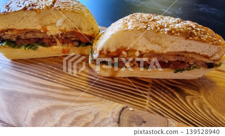 Close-up Shot Of A Burger With Beef On Wooden Surface Close-up Shot Of A Burger With Beef On Wooden Surface 139528940
