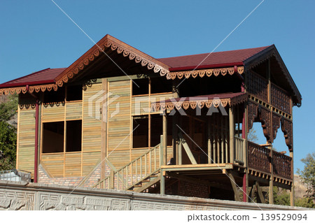 Balcony architectural detail. Wooden garden house. Balcony architectural detail. Wooden garden house. 139529094