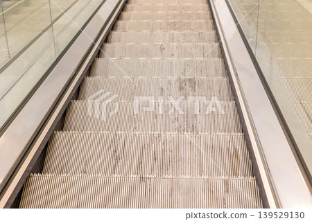 moving escalator in airport or shopping mall moving escalator in airport or shopping mall 139529130