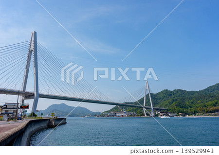 Ikuchi Bridge as seen from Innoshima Island: A representative bridge landscape of the Shimanami Kaido in the Seto Inland Sea, Onomichi City, Hiroshima Prefecture. Ikuchi Bridge as seen from Innoshima Island: A representative bridge landscape of the Shimanami Kaido in the Seto Inland Sea, Onomichi City, Hiroshima Prefecture. 139529941