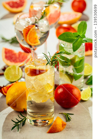 Refreshing summer cocktails with citrus on a white marble table. 139530699