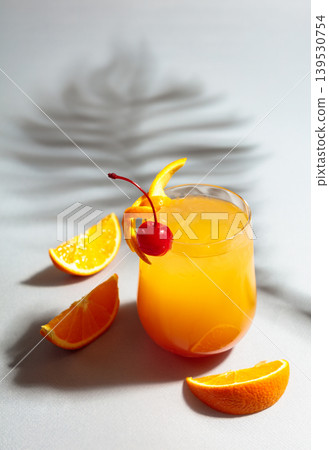 Cocktail Tequila sunrise with orange juice, silver tequila, grenadine, and ice. Cocktail Tequila sunrise with orange juice, silver tequila, grenadine, and ice. 139530754