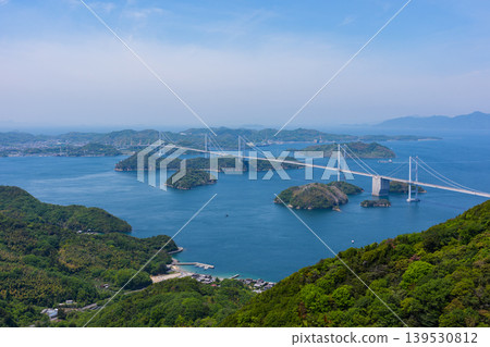 A spectacular view of the Kurushima Kaikyo Bridge and the islands of the Seto Inland Sea from Kirosan Observation Park, part of the Shimanami Kaido, Imabari City, Ehime Prefecture. A spectacular view of the Kurushima Kaikyo Bridge and the islands of the Seto Inland Sea from Kirosan Observation Park, part of the Shimanami Kaido, Imabari City, Ehime Prefecture. 139530812