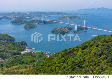 A spectacular view of the Kurushima Kaikyo Bridge and the islands of the Seto Inland Sea from Kirosan Observation Park, part of the Shimanami Kaido, Imabari City, Ehime Prefecture. A spectacular view of the Kurushima Kaikyo Bridge and the islands of the Seto Inland Sea from Kirosan Observation Park, part of the Shimanami Kaido, Imabari City, Ehime Prefecture. 139530821