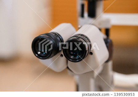 Close-up view of ophthalmology autorefractor lenses device for eye examination in clinic Close-up view of ophthalmology autorefractor lenses device for eye examination in clinic 139530953