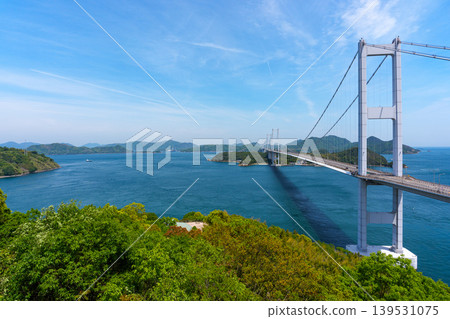A spectacular view of the Kurushima Kaikyo Bridge and the Seto Inland Sea from Itoyama Park, the world's first triple suspension bridge, in Imabari City, Ehime Prefecture. A spectacular view of the Kurushima Kaikyo Bridge and the Seto Inland Sea from Itoyama Park, the world's first triple suspension bridge, in Imabari City, Ehime Prefecture. 139531075