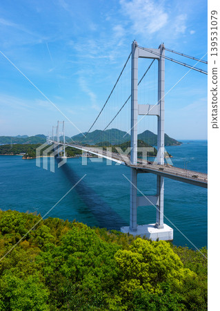 A spectacular view of the Kurushima Kaikyo Bridge and the Seto Inland Sea from Itoyama Park, the world's first triple suspension bridge, in Imabari City, Ehime Prefecture. A spectacular view of the Kurushima Kaikyo Bridge and the Seto Inland Sea from Itoyama Park, the world's first triple suspension bridge, in Imabari City, Ehime Prefecture. 139531079