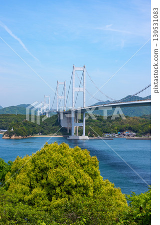 A spectacular view of the Kurushima Kaikyo Bridge and the Seto Inland Sea from Itoyama Park, the world's first triple suspension bridge, in Imabari City, Ehime Prefecture. A spectacular view of the Kurushima Kaikyo Bridge and the Seto Inland Sea from Itoyama Park, the world's first triple suspension bridge, in Imabari City, Ehime Prefecture. 139531083